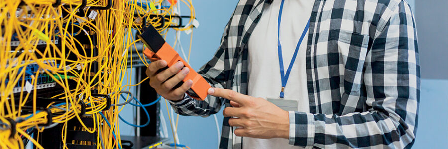 young-man-looking-at-fiber-optic-tester